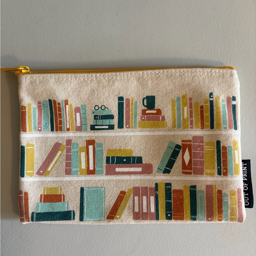 Out of Print Cream Canvas Book Shelf Print Zipper Pouch with Yellow Trim